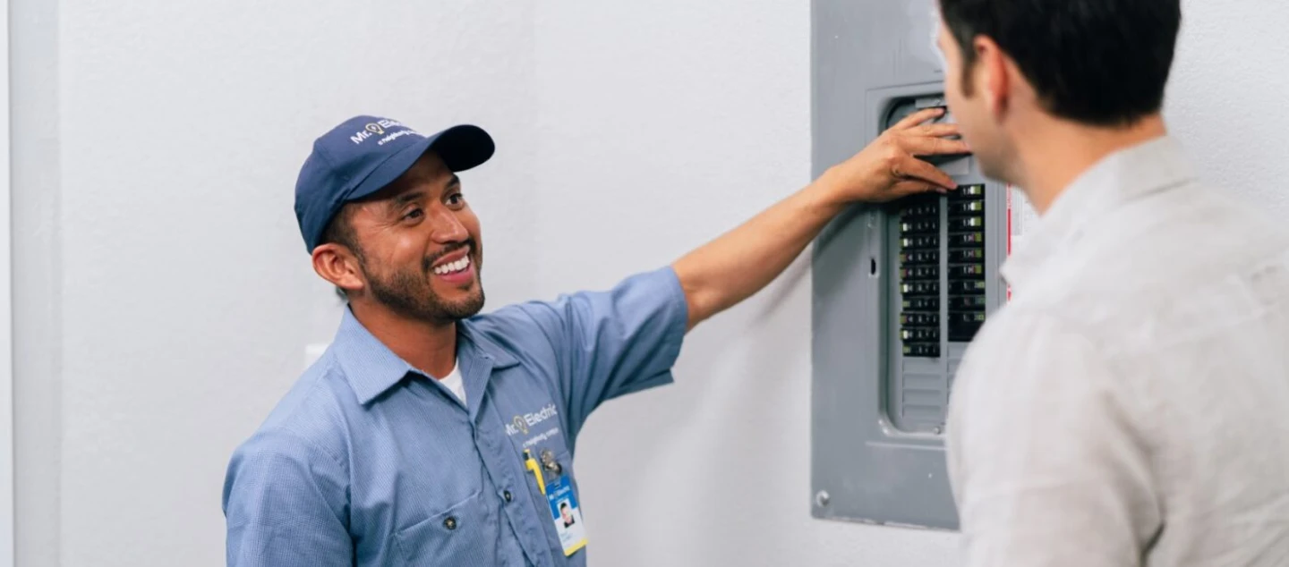 Mr. Electric electrician explains circuit setup to the customer.